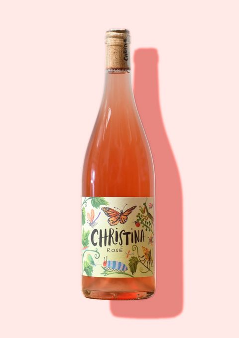 Bottle of Christina Netzl's natural rose wine, vibrant pink and organically made
